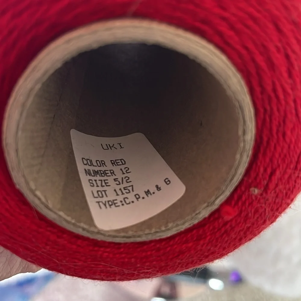 A spool of red cotton for sewing and crochet work basically new and vintage